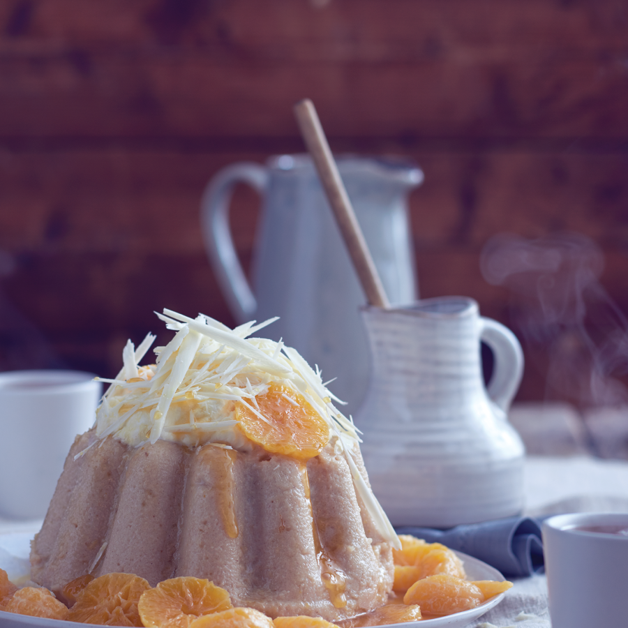 Griesmeelpudding met kaneel, gekonfijte mandarijntjes en witte chocolade